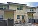 Relax outside on the back patio area with table and chair seating at 440 Berckman Nw Dr, Lilburn, GA 30047
