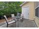 The cozy back patio area includes an outdoor table and chairs at 440 Berckman Nw Dr, Lilburn, GA 30047