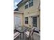 This back patio features a table, chairs, and access to the home at 440 Berckman Nw Dr, Lilburn, GA 30047