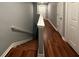 A view of the stairway with wood steps and white railings leading to the second floor hallway at 440 Berckman Nw Dr, Lilburn, GA 30047