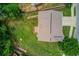 Aerial view of a house featuring a well-maintained lawn and a wooden deck at 1727 Shire Village Dr, Sugar Hill, GA 30518