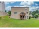 Back view of home with a deck, sliding glass door, and a walkout basement at 1727 Shire Village Dr, Sugar Hill, GA 30518