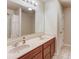 Bathroom featuring double sinks, wood cabinets and tile flooring at 1727 Shire Village Dr, Sugar Hill, GA 30518