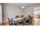 Elegant dining room with hardwood floors, classic furniture, and stylish lighting fixture at 1727 Shire Village Dr, Sugar Hill, GA 30518