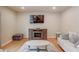 Cozy living room with hardwood floors, neutral paint and furnishings at 1727 Shire Village Dr, Sugar Hill, GA 30518