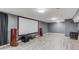 Spacious theater room featuring a big screen, speakers and luxury vinyl plank flooring at 1727 Shire Village Dr, Sugar Hill, GA 30518