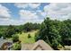 Scenic aerial view of the neighborhood featuring lush green trees and beautiful landscaping at 2640 Preston Ridge Ln, Dacula, GA 30019