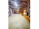 Unfinished basement featuring exposed beams, concrete floors and some furniture at 2640 Preston Ridge Ln, Dacula, GA 30019