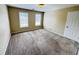 Bedroom with two windows offering natural light and carpeted floors at 2640 Preston Ridge Ln, Dacula, GA 30019