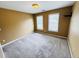 A bedroom featuring two windows, providing natural light, and carpet flooring at 2640 Preston Ridge Ln, Dacula, GA 30019