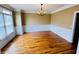 Classic dining room with hardwood floors, decorative molding, and a chandelier at 2640 Preston Ridge Ln, Dacula, GA 30019