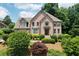 Charming two-story brick home with mature landscaping and inviting front entrance at 2640 Preston Ridge Ln, Dacula, GA 30019