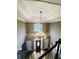 Grand foyer with high ceilings, a chandelier, and elegant staircase at 2640 Preston Ridge Ln, Dacula, GA 30019