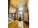 Welcoming foyer showcasing hardwood floors and an elegant chandelier at 2640 Preston Ridge Ln, Dacula, GA 30019