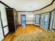 Bright eat-in kitchen area with wood floors and cabinetry and access to the outdoor patio at 2640 Preston Ridge Ln, Dacula, GA 30019