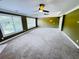 Spacious living room boasts plush carpet, recessed lighting, and numerous windows for natural light at 2640 Preston Ridge Ln, Dacula, GA 30019