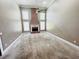 Open living room with a brick fireplace, high ceilings, and multiple windows at 2640 Preston Ridge Ln, Dacula, GA 30019