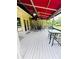Covered patio area with outdoor seating and ceiling fans at 2640 Preston Ridge Ln, Dacula, GA 30019