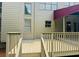 Back of house with patio, awning, and staircase to the yard at 2640 Preston Ridge Ln, Dacula, GA 30019