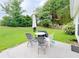 Outdoor patio with furniture in a grassy backyard setting at 2647 Midler Ct, Buford, GA 30519