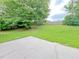 A spacious backyard features a concrete patio, grassy lawn, and privacy fence, perfect for outdoor living at 2647 Midler Ct, Buford, GA 30519