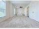 Bright bedroom with a large window, plush carpet, ceiling fan and white trim at 2647 Midler Ct, Buford, GA 30519