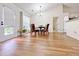 Cozy dining area with hardwood floors, a modern light fixture, and a view of the backyard at 2647 Midler Ct, Buford, GA 30519