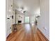 Spacious living room featuring beautiful hardwood floors, a fireplace, a ceiling fan, and neutral-toned walls at 2647 Midler Ct, Buford, GA 30519