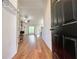 Bright, open living room with hardwood floors, a fireplace, a ceiling fan, and ample natural light at 2647 Midler Ct, Buford, GA 30519