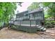 Exterior of home showcasing a multi-level wooden deck and backyard area, perfect for outdoor living at 425 Bellflower Ct, Roswell, GA 30076
