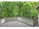 Spacious backyard deck surrounded by lush greenery, creating a peaceful outdoor retreat at 425 Bellflower Ct, Roswell, GA 30076