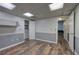 Basement featuring wood floors, modern lighting, and a large open space, great for recreation at 425 Bellflower Ct, Roswell, GA 30076
