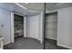 Basement storage area featuring carpeted floor and shelving, ideal for organized storage at 425 Bellflower Ct, Roswell, GA 30076