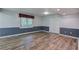 A finished basement boasts two-tone walls, modern flooring, and abundant natural light at 425 Bellflower Ct, Roswell, GA 30076