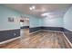 An expansive basement is enhanced by stylish flooring and modern lighting at 425 Bellflower Ct, Roswell, GA 30076