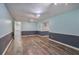 A spacious basement features modern lighting and stylish flooring at 425 Bellflower Ct, Roswell, GA 30076