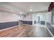 An open basement features new flooring and updated lighting at 425 Bellflower Ct, Roswell, GA 30076