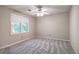 Bedroom featuring a ceiling fan and window with natural light at 425 Bellflower Ct, Roswell, GA 30076