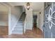 Inviting foyer with hardwood floors, stairway and decorative front door at 425 Bellflower Ct, Roswell, GA 30076