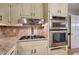 Gourmet kitchen details featuring stainless steel appliances, gas range, and custom cabinetry at 425 Bellflower Ct, Roswell, GA 30076