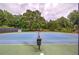 Outdoor tennis court with a green and blue playing surface at 425 Bellflower Ct, Roswell, GA 30076