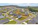 An aerial view of a housing community with green spaces, well-manicured lawns, and modern houses at 600 Tudor St, Kingston, GA 30145