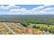 Aerial view showcasing a new construction neighborhood surrounded by lush green forests at 600 Tudor St, Kingston, GA 30145