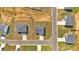 High angle aerial view of home rooftops and driveways in a modern residential neighborhood at 600 Tudor St, Kingston, GA 30145
