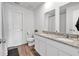 The bathroom offers double sinks with granite countertops, wooden vinyl flooring, and a separate toilet at 600 Tudor St, Kingston, GA 30145