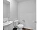 Bathroom with vanity sink and toilet at 600 Tudor St, Kingston, GA 30145