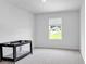 Neutral bedroom with a window providing natural light and a crib at 600 Tudor St, Kingston, GA 30145
