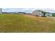 Expansive grassy lot ready for building in a residential neighborhood near completed homes at 600 Tudor St, Kingston, GA 30145