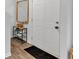 Entryway with wood floors, a coat rack and a mirror on the wall at 600 Tudor St, Kingston, GA 30145