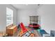 Bright playroom with a window, bench, slide, and trampoline at 600 Tudor St, Kingston, GA 30145